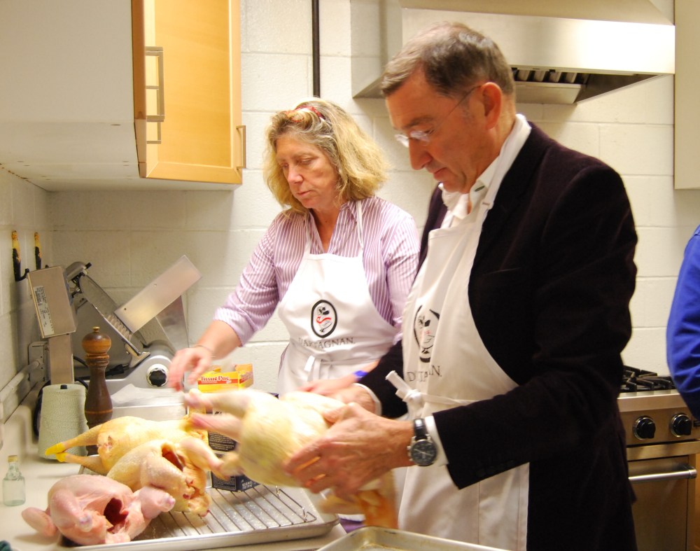 Ariane and Chef Antoine prepping the 4 chickens for the oven.