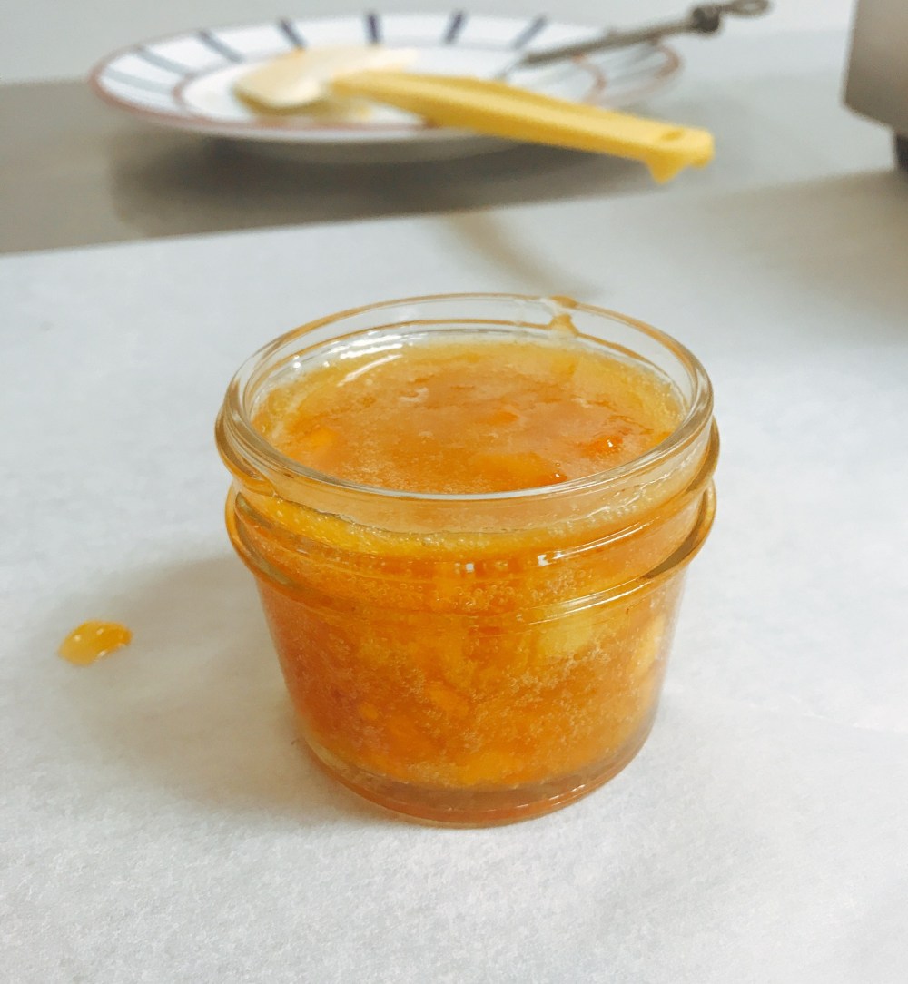 Persimmon preserves in open jar