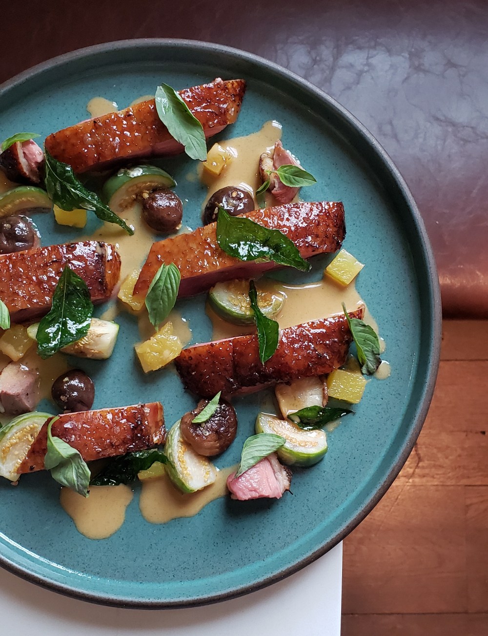 Smoked and dry aged Rohan duck, pineapple, thai eggplant, thai basil, fried curry leaf, duck red curry sauce